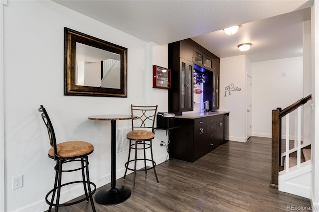 11823 Barrentine Loop, Parker, CO 80138 - bar featuring dark wood-style floors and stairway