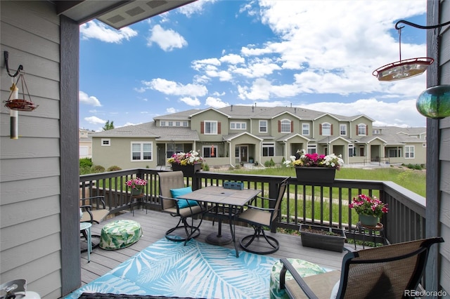 11823 Barrentine Loop, Parker, CO 80138 - view of wooden balcony featuring a residential view, outdoor dining area, and a deck