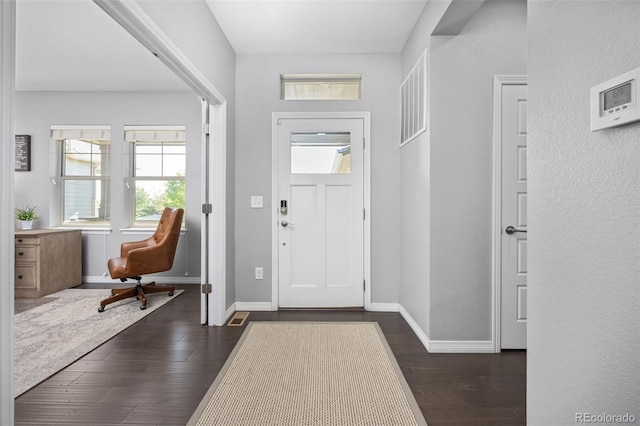 525 Grenville Cir, Erie, CO 80516 - entryway featuring dark wood-style flooring and baseboards