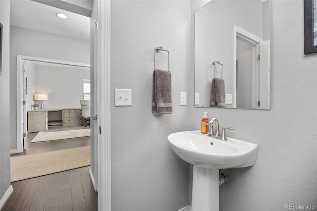 525 Grenville Cir, Erie, CO 80516 - bathroom with wood finished floors and baseboards