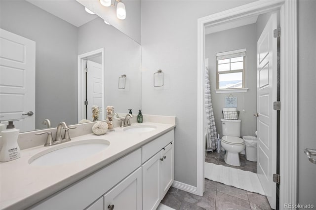 525 Grenville Cir, Erie, CO 80516 - bathroom featuring toilet and double vanity