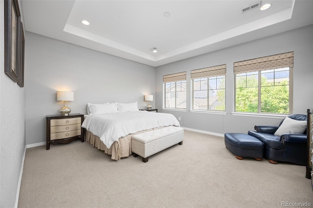 525 Grenville Cir, Erie, CO 80516 - bedroom featuring a raised ceiling, light carpet, baseboards, and recessed lighting