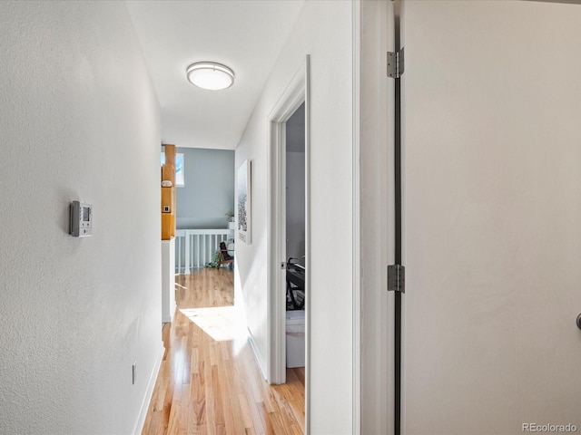 hallway featuring light wood-type flooring