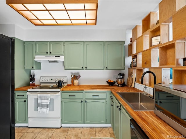 kitchen featuring white range with electric stovetop, green cabinets, black refrigerator, sink, and wood counters