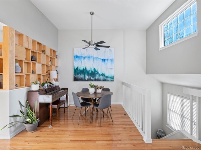 dining room with light wood-type flooring and ceiling fan