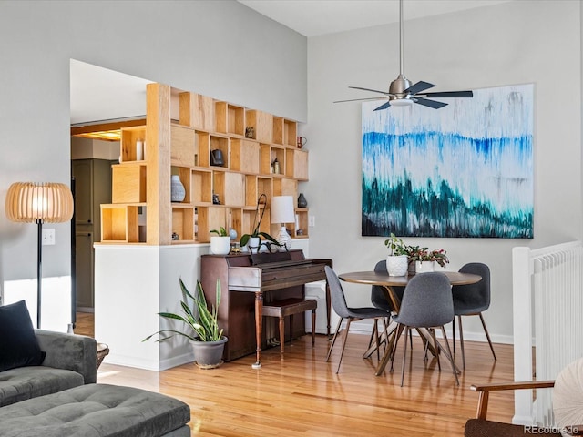 interior space featuring hardwood / wood-style flooring, ceiling fan, and radiator heating unit