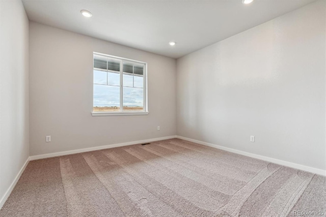 unfurnished room with carpet floors