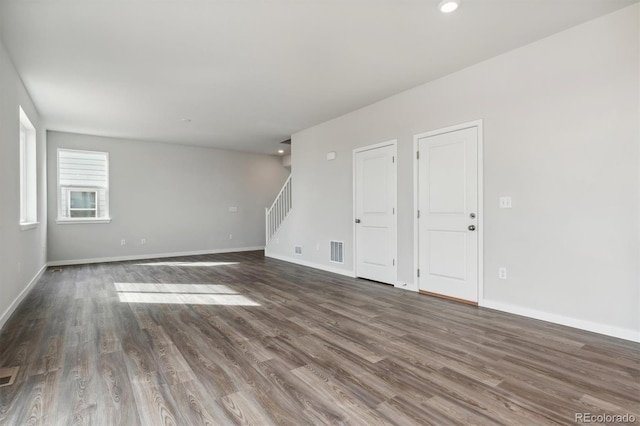 spare room with dark wood-type flooring