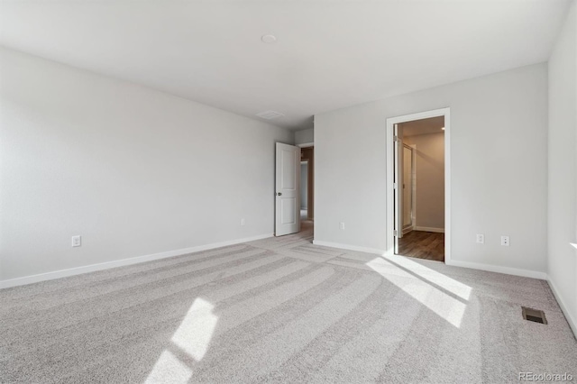 unfurnished bedroom featuring light colored carpet