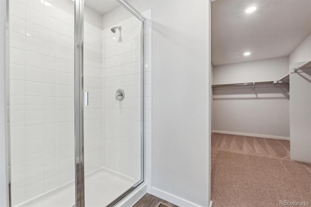 bathroom featuring an enclosed shower