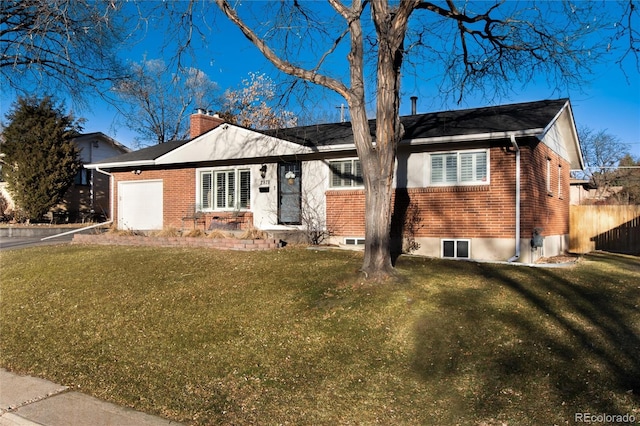 ranch-style house with brick siding, a chimney, an attached garage, and a front lawn