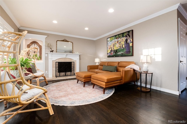 living area with recessed lighting, a tile fireplace, dark wood finished floors, and crown molding