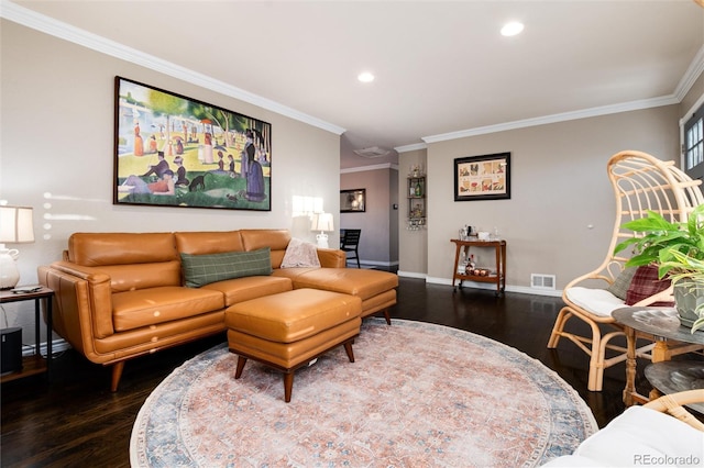 living area featuring wood finished floors, visible vents, and crown molding