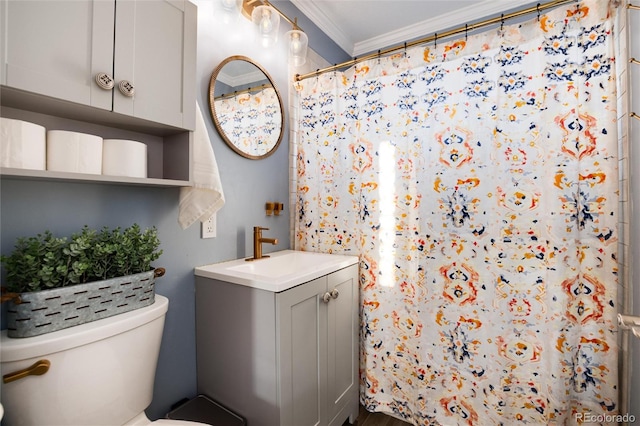 bathroom featuring toilet, a shower with curtain, ornamental molding, and vanity