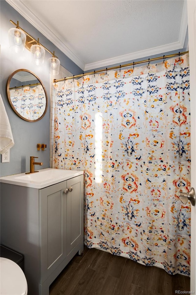 full bathroom with toilet, ornamental molding, vanity, wood finished floors, and a shower with curtain