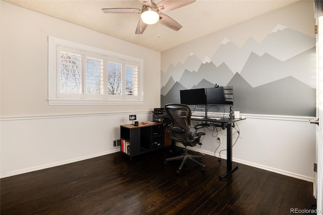 home office with visible vents, baseboards, a ceiling fan, wood finished floors, and a textured ceiling