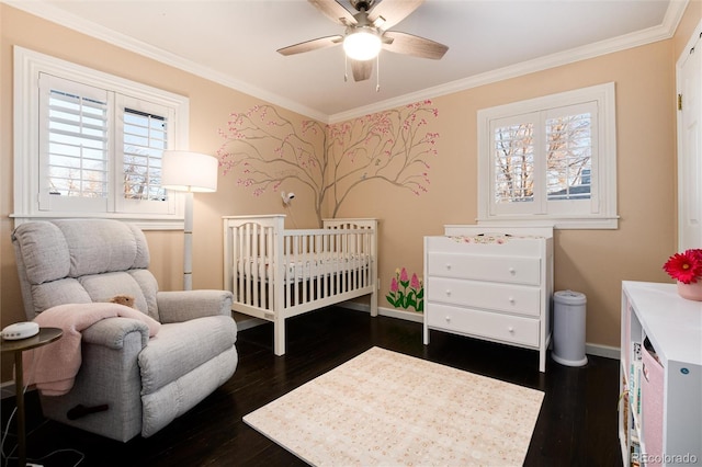 bedroom featuring dark wood-style flooring, ornamental molding, multiple windows, and baseboards