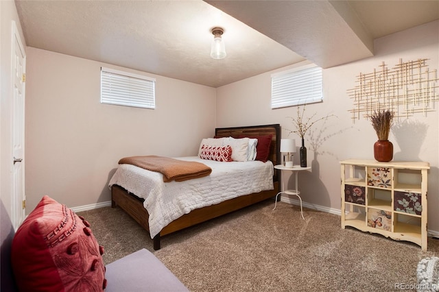 bedroom featuring baseboards and carpet flooring