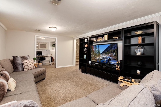 carpeted living room with stairway, baseboards, built in shelves, and visible vents