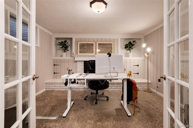 carpeted home office with crown molding and french doors