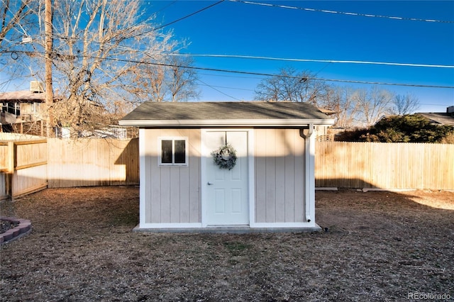 view of shed with a fenced backyard