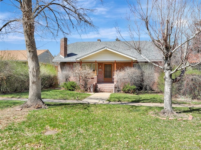 ranch-style house featuring a front yard