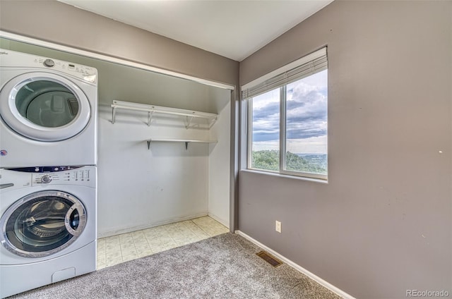 21540 Ridgeline Dr S, Trinidad, CO 81082 - washroom with stacked washer and clothes dryer and carpet flooring