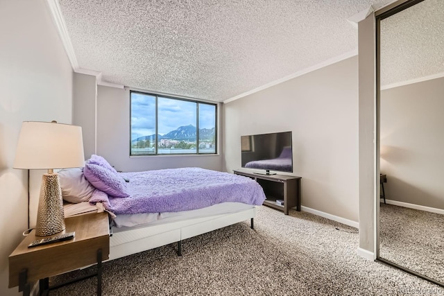 bedroom with carpet floors, crown molding, and a textured ceiling