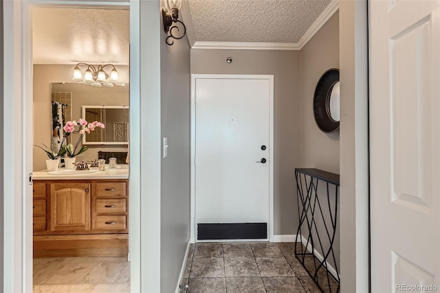 1850 Folsom St Unit 402, Boulder, CO 80302 - entrance foyer with ornamental molding, baseboards, a chandelier, and a textured ceiling