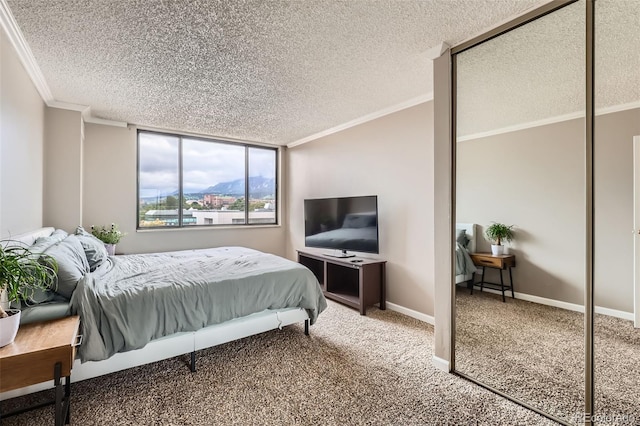 1850 Folsom St Unit 402, Boulder, CO 80302 - bedroom featuring crown molding, a textured ceiling, carpet flooring, and baseboards
