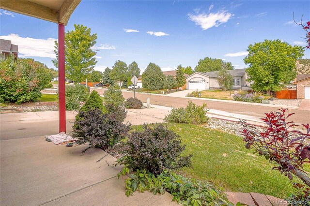 view of yard featuring a garage