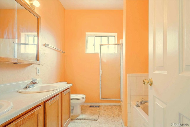 full bathroom with dual vanity, shower with separate bathtub, toilet, and tile patterned flooring