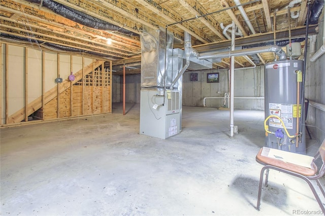 basement with water heater and heating unit