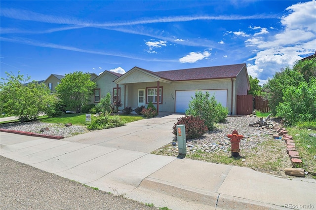1508 Atchison Ave, Trinidad, CO 81082 - ranch-style house with an attached garage, stucco siding, and driveway