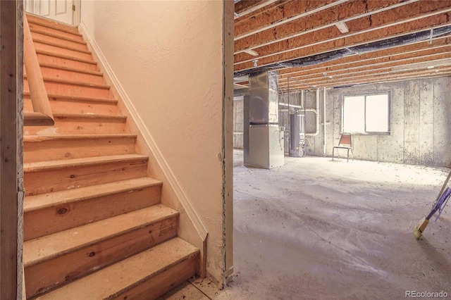 1508 Atchison Ave, Trinidad, CO 81082 - below grade area featuring stairway, heating unit, and water heater