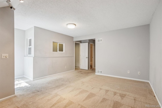 2453 S Xanadu Way Unit C, Aurora, CO 80014 - empty room featuring carpet and a textured ceiling