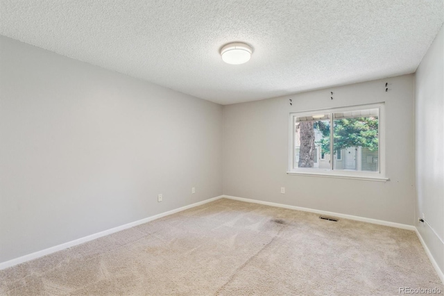 2453 S Xanadu Way Unit C, Aurora, CO 80014 - empty room with carpet and a textured ceiling