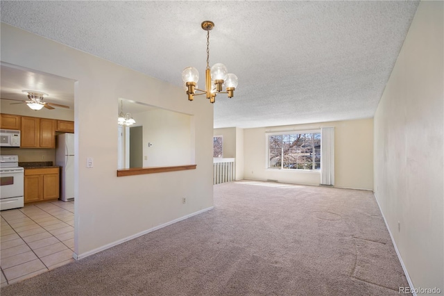 interior space featuring a textured ceiling, light tile patterned flooring, light colored carpet, ceiling fan with notable chandelier, and baseboards