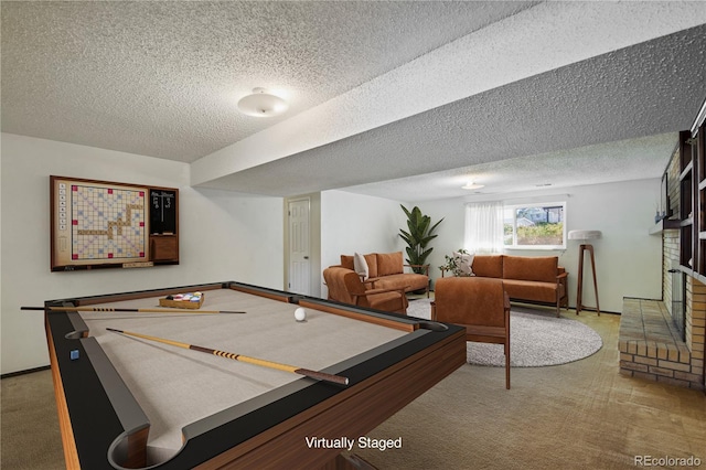 playroom featuring carpet floors, billiards, a fireplace, and a textured ceiling