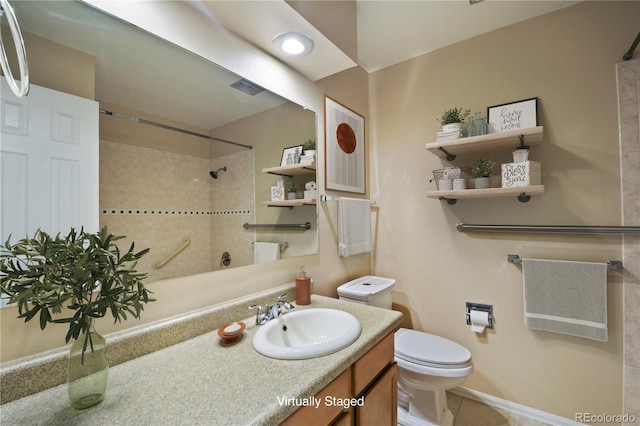 bathroom with vanity, walk in shower, toilet, and tile patterned floors