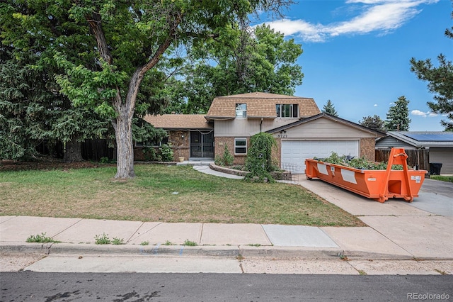 8727 E Girard Ave, Denver, CO 80231 - view of front of property featuring brick siding, roof with shingles, an attached garage, a front lawn, and concrete driveway
