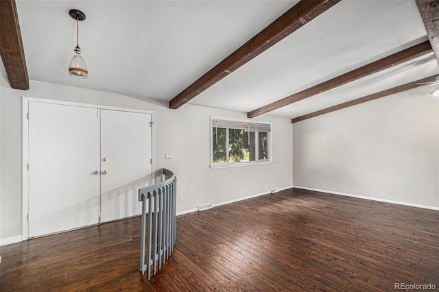 8727 E Girard Ave, Denver, CO 80231 - empty room featuring beam ceiling and wood finished floors