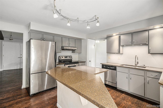 8727 E Girard Ave, Denver, CO 80231 - kitchen with appliances with stainless steel finishes, gray cabinetry, under cabinet range hood, and dark wood finished floors