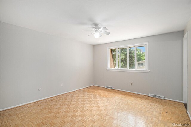 8727 E Girard Ave, Denver, CO 80231 - unfurnished room featuring a ceiling fan and baseboards