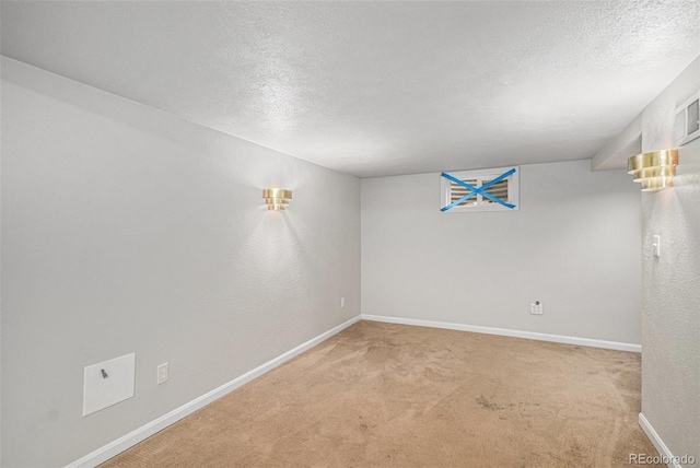 8727 E Girard Ave, Denver, CO 80231 - unfurnished room featuring a textured ceiling and carpet flooring