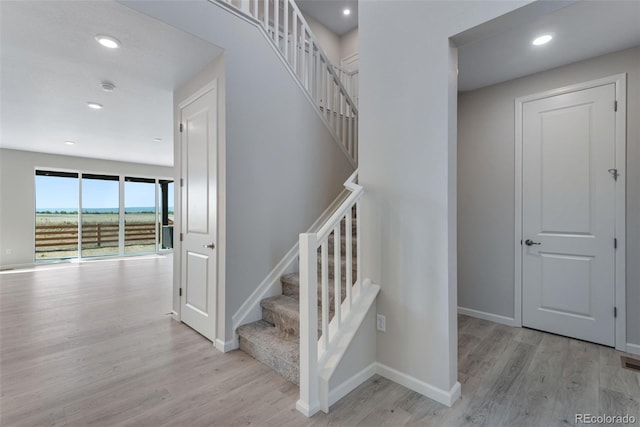 13398 E 99th Pl, Commerce City, CO 80022 - staircase featuring wood finished floors, baseboards, and recessed lighting