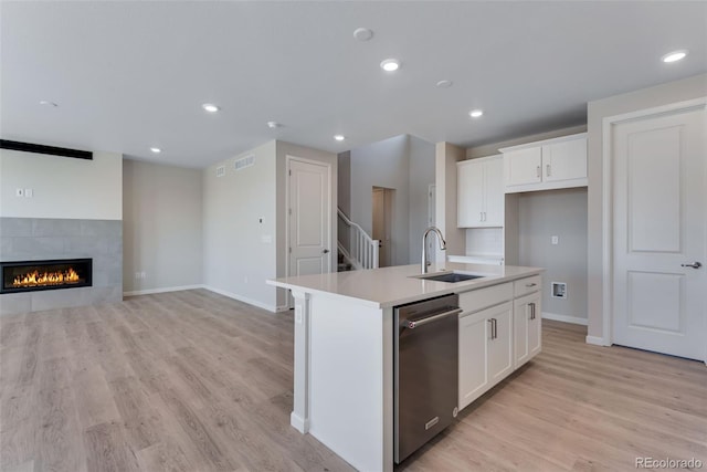 13398 E 99th Pl, Commerce City, CO 80022 - kitchen featuring stainless steel dishwasher, a sink, light wood-type flooring, a center island with sink, and recessed lighting