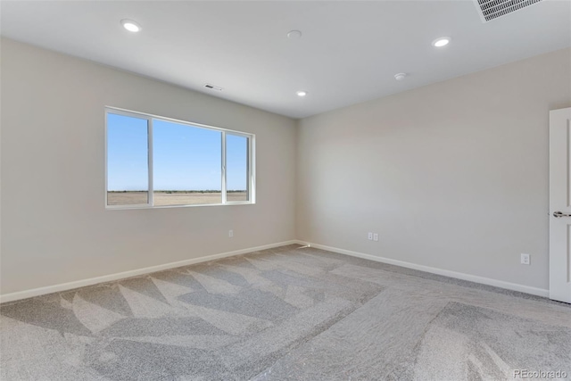 13398 E 99th Pl, Commerce City, CO 80022 - unfurnished room with light colored carpet, baseboards, and recessed lighting