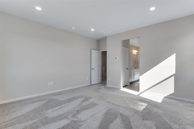 13398 E 99th Pl, Commerce City, CO 80022 - spare room with light carpet, baseboards, and recessed lighting