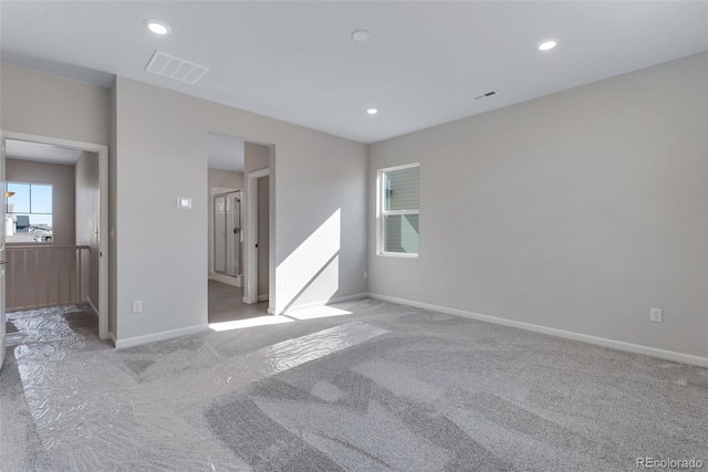 13398 E 99th Pl, Commerce City, CO 80022 - spare room with light colored carpet, baseboards, and recessed lighting